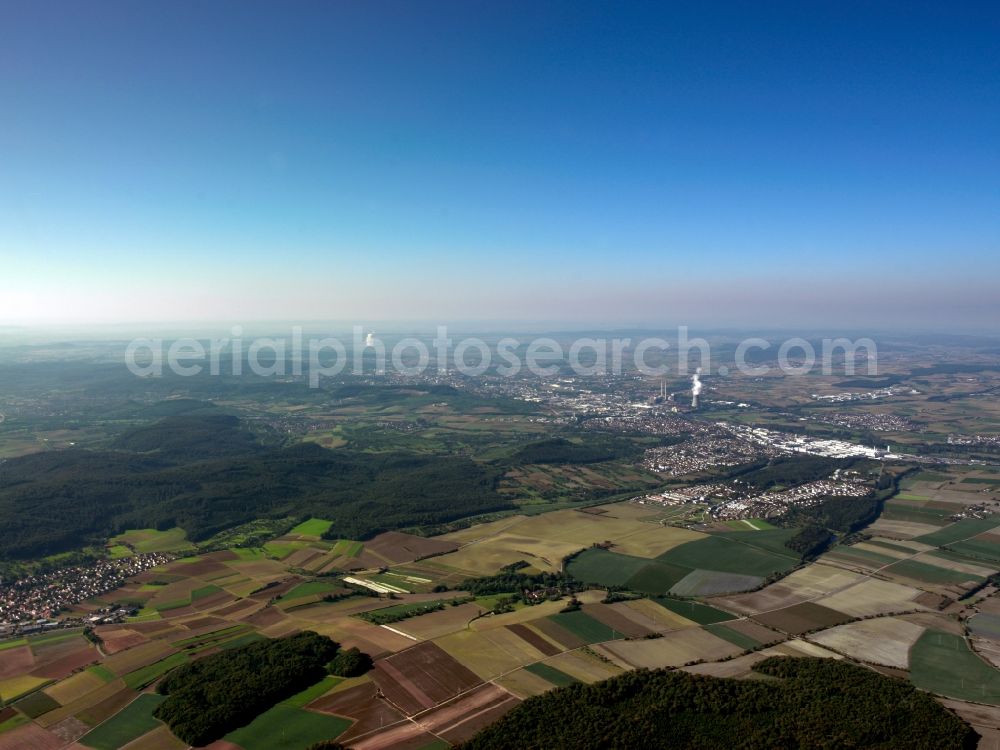 Aerial image Heilbronn - The landscape of Heilbronn in the state of Baden-Württemberg. The different fields of the county and surrounding the city are visible. In the background lies the industrial area of the city, marked by smoke coming from the local heating plant. The river Neckar runs through the envirounment as well