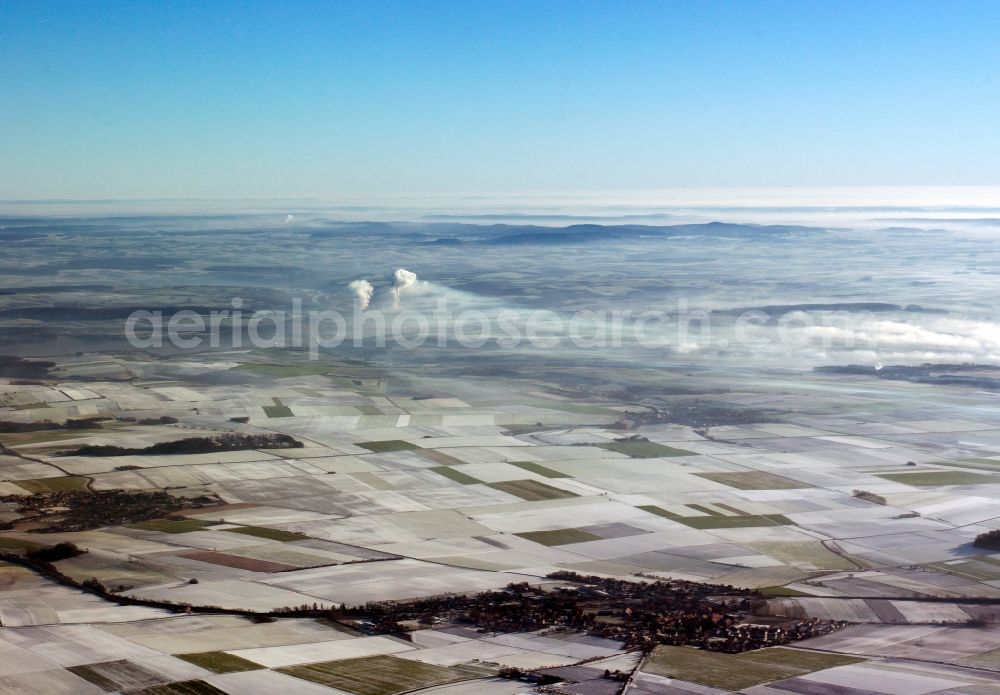 Aerial photograph Heilbronn - The landscape of Heilbronn in the state of Baden-Württemberg. The different fields of the county and surrounding the city are visible. In the background lies the industrial area of the city, marked by smoke coming from the local heating plant. The river Neckar runs through the envirounment as well