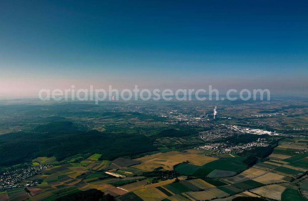 Heilbronn from above - The landscape of Heilbronn in the state of Baden-Württemberg. The different fields of the county and surrounding the city are visible. In the background lies the industrial area of the city, marked by smoke coming from the local heating plant. The river Neckar runs through the envirounment as well