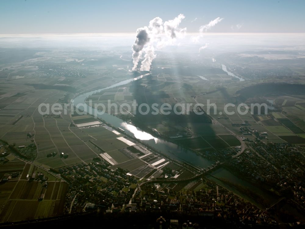 Heilbronn from the bird's eye view: The landscape of Heilbronn in the state of Baden-Württemberg. The different fields of the county and surrounding the city are visible. In the background lies the industrial area of the city, marked by smoke coming from the local heating plant. The river Neckar runs through the envirounment as well