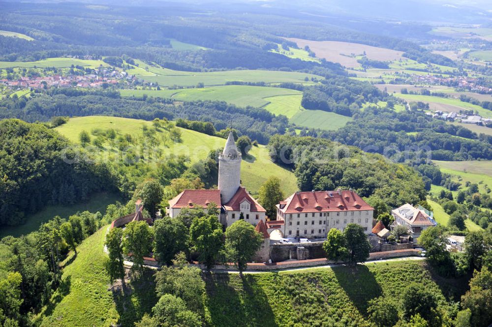 Seitenroda from above - Die Burg Leuchtenburg in Seitenroda bei Kahla im Thüringer Wald, Thüringen. Sie gilt als die Königin des Saaletals und liegt auf einem weithin sichtbaren Bergkegel auf einer Höhe von fast 400 Metern. Die Burg gehört der Stiftung Leuchtenburg. The castle Leuchtenburg in Seitenroda in the Thuringian Forest. It is considered as the Queen of the Saale valley and situated on large conical mountain peak at an altitude of almost 400 meters. It belongs to the foundation Leuchtenburg.