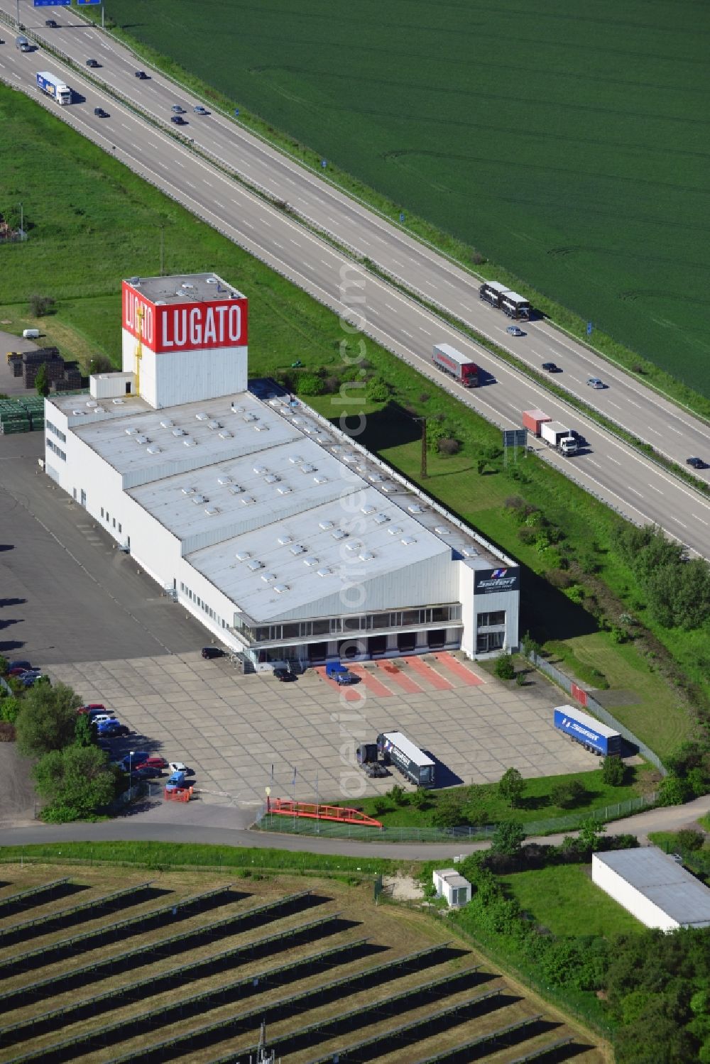 Lützen from the bird's eye view: The Lugato facility in the commercial park in the Zorbau part of Lützen in the state of Saxony-Anhalt. The industrial building is not used by the company anymore but it is a landmark for the commercial area