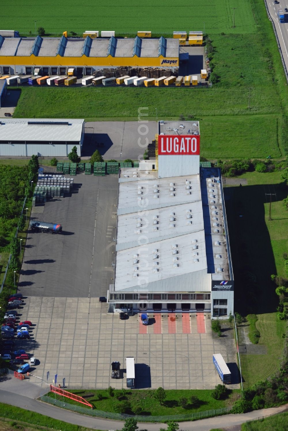 Aerial photograph Lützen - The Lugato facility in the commercial park in the Zorbau part of Lützen in the state of Saxony-Anhalt. The industrial building is not used by the company anymore but it is a landmark for the commercial area