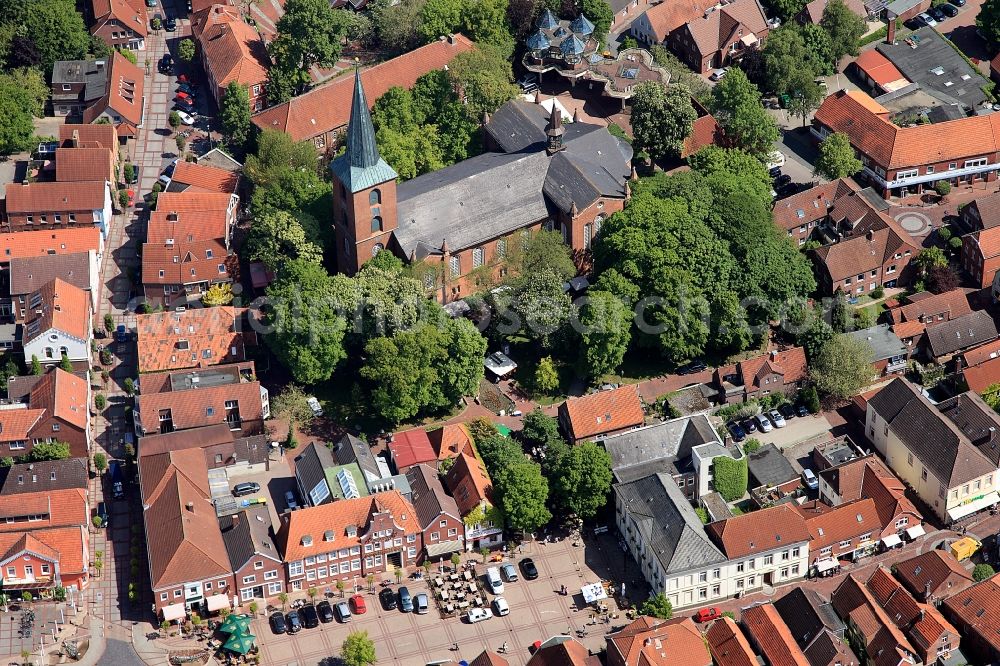 Esens from the bird's eye view: The Evangelical Lutheran St. Magnus Church in the city Esen was built in 1848 until 1854. It is named after St. Magnus of Trani. The St Magnus Church is a three-nave church of brick with a wide transept. The building merges Romanesque and Gothic elements. The bell tower is now a museum