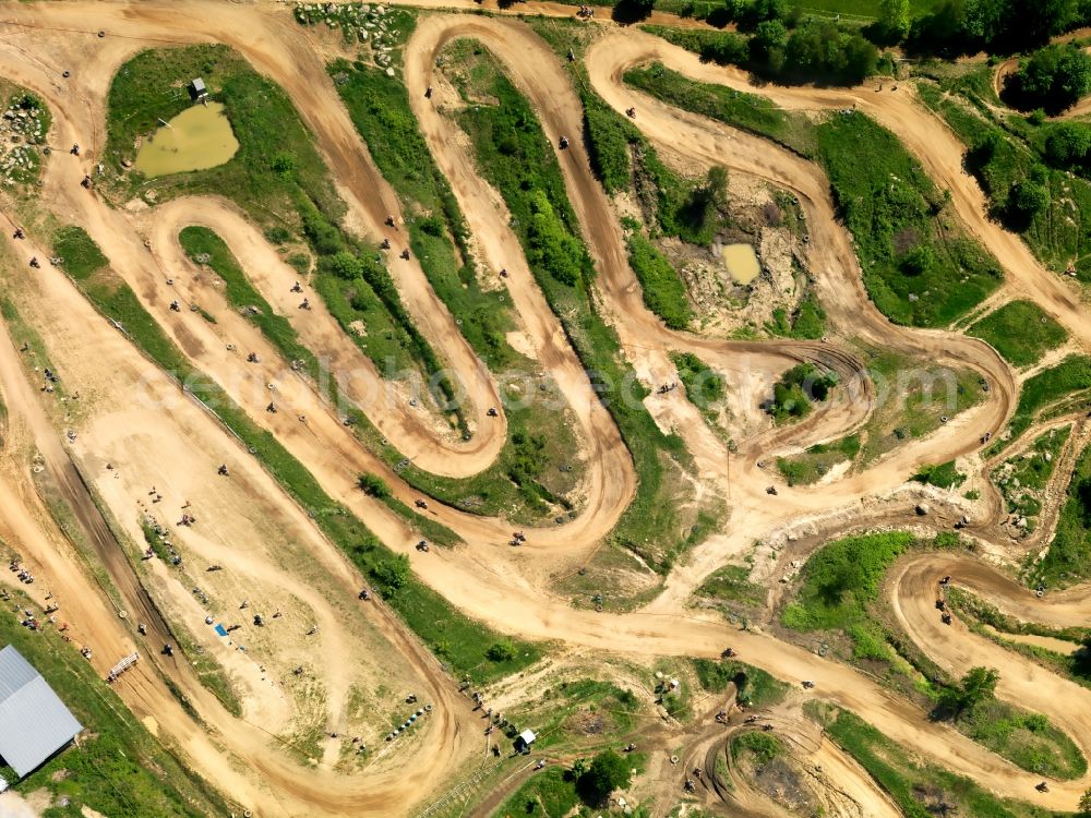 Aerial photograph Reisersberg - The motocross circuit in Reisersberg in the state of Bavaria. The ACC race is taking place. The track is very close to the village of Reisersberg and is run by the association MCC Röhrnbach-Reisersberg. It is the site of yearly motocross, enduro and youth races