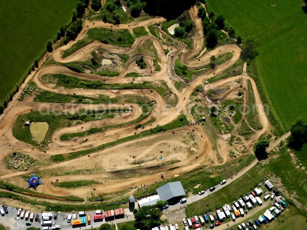 Reisersberg from the bird's eye view: The motocross circuit in Reisersberg in the state of Bavaria. The ACC race is taking place. The track is very close to the village of Reisersberg and is run by the association MCC Röhrnbach-Reisersberg. It is the site of yearly motocross, enduro and youth races