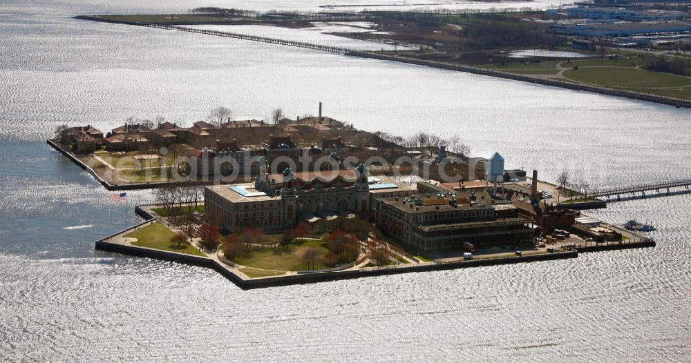 New York from above - View of Ellis Island in thr harbour of New York. For long time, it has been the home of the immigration office in the United States. Since 1990, the island is a public museum about migrationship in the USA