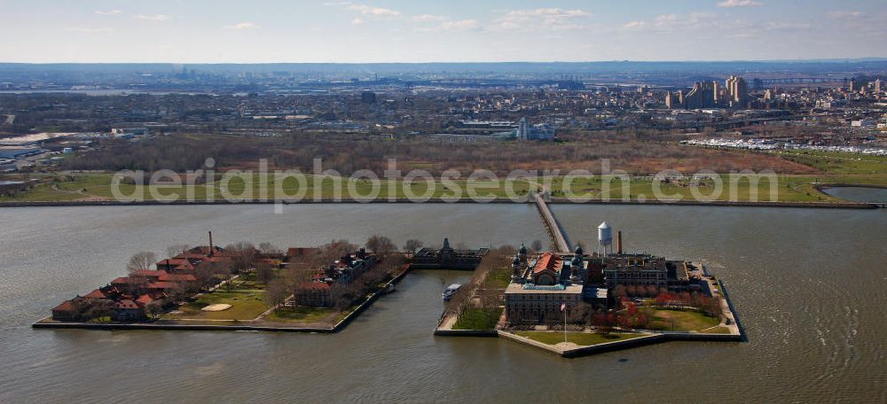 New York from the bird's eye view: View of Ellis Island in thr harbour of New York. For long time, it has been the home of the immigration office in the United States. Since 1990, the island is a public museum about migrationship in the USA