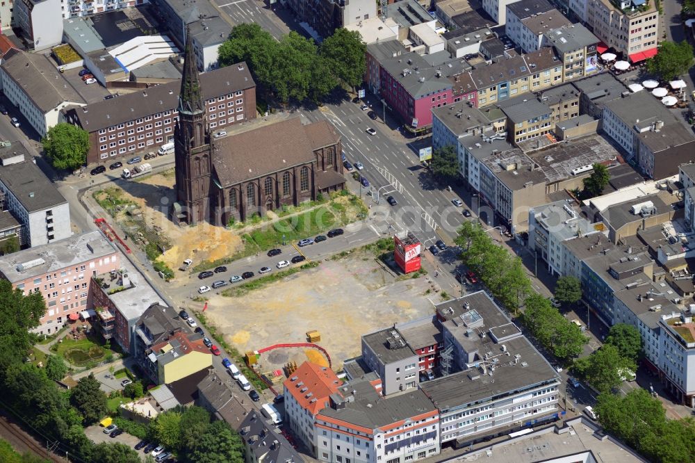 Aerial image Bochum - The construction site of the music center at Marienplatz in the Viktoria Quarter in Bochum in the state of North Rhine - Westphalia. The center will be the new home for the Bochum Symphonic Orchestra. It was designed by Bez+Kock architects. The adjacent church Marienkirche will be integrated in the centre