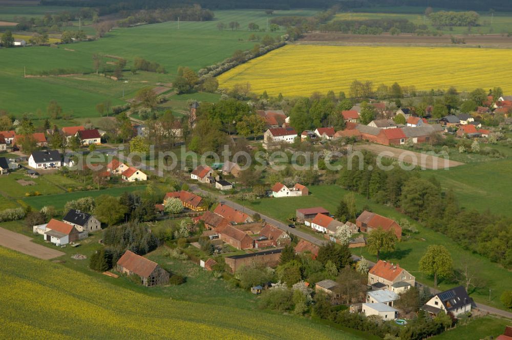 Aerial photograph Lichtenberg - Blick auf den Ort Lichtenberg in Brandenburg. Die Ortschaft ist ein Ortsteil von Neuruppin. Gegründet wurde das Dorf im 14. Jahrhundert und gehörte zum Kloster Lindow. Seit 1872 gehürt es zu Neuruppin. Die Ortschaft hat ca. 190 Einwohner. Kontakt: Stadtverwaltung der Fontanestadt Neuruppin, Karl-Liebknecht-Straße 33/34, 16816 Neuruppin, Tel. 03391 / 355186, stadt@stadtneuruppin.de