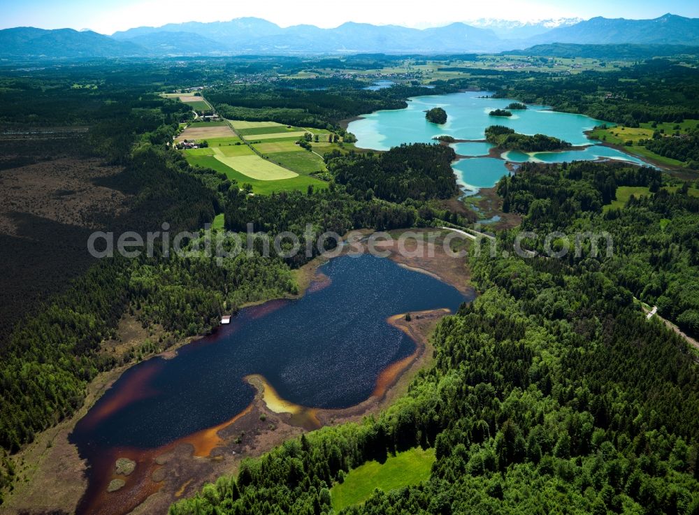 Seeshaupt from above - The lakes of the Osternseen region in the county of Seeshaupt in the state of Bavaria. The lakes are a group of waters and moors in the region of Upper Bavaria and build the nature park and preservation area of Osterseen. They have been awarded the official seal of quality of Bavaria's most beautiful Geotops