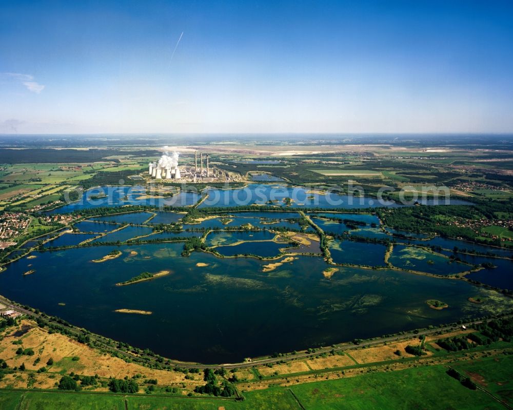 Peitz from above - The Peitzer Teiche in the county district of Spree-Neiße in the state of Brandenburg. The area consists of ponds, resulting in an area of 1000 ha which makes it the largest connected pond area of Germany. It is used for fishing. In the background visible is the heating power plant Jänschwalde, the third largest power plant in Germany
