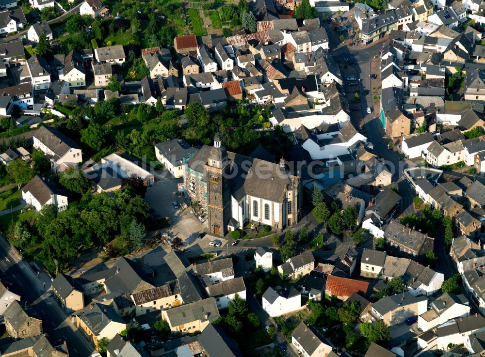 Aerial photograph Kruft - The parish church in Kruft located in the city center. It is surrounded by residential buildings and trees. The church is the St.. Dionysius devoted