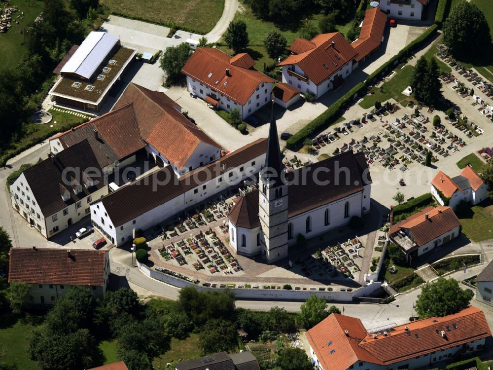 Aerial image Aschau - The parish church of the Assumption is located on the outskirts of town. The church is surrounded by various buildings. The immediately adjacent cemetery is bordered on one side with a church wall