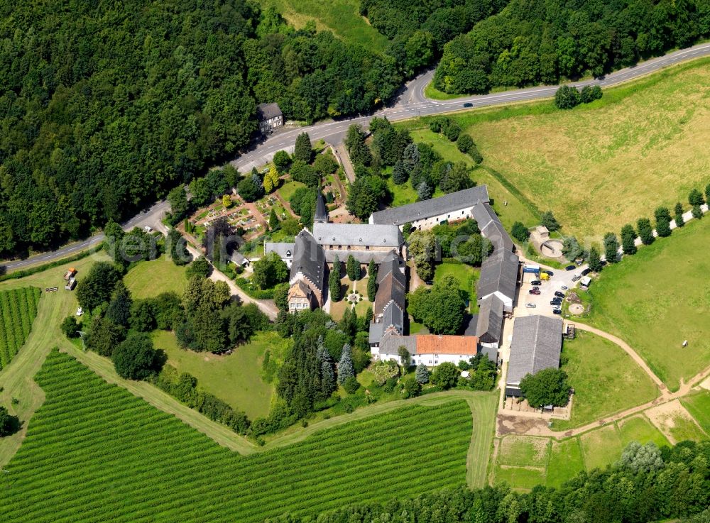 Langerwehe from the bird's eye view: St. Catherine's parish church in the district of Düren and lying to Langerwehe part Wenau community belonging. The church dates from the 12th Century and today serves both religious and social functions. The parish is situated on the edge of a forest and is affected by a road