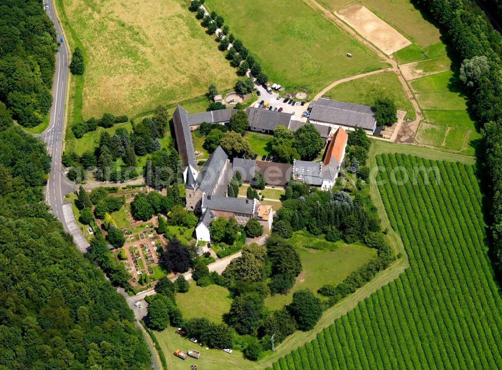 Aerial image Langerwehe - St. Catherine's parish church in the district of Düren and lying to Langerwehe part Wenau community belonging. The church dates from the 12th Century and today serves both religious and social functions. The parish is situated on the edge of a forest and is affected by a road