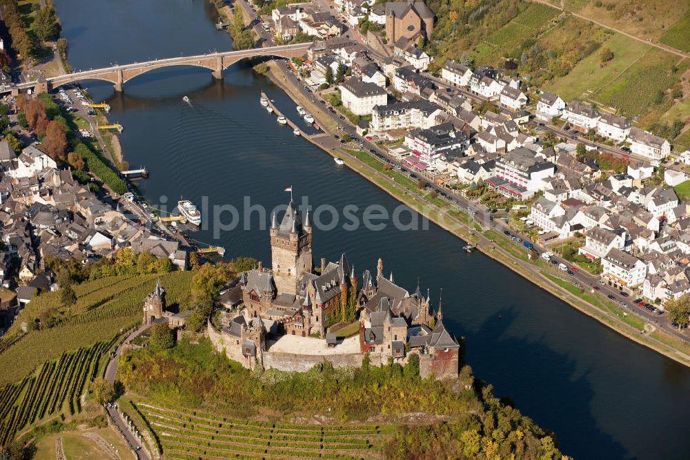 Aerial image Cochem - The Cochem Castle is a castle at the Mosel river in the Rhineland-Palatinate town of Cochem. After it had been destroyed in the 17th century, the businessman Louis Frédéric Jacques Ravené rebuilt the castle according to the taste of romanticism between 1868 to 1877. Today the castle is a museum and event space. The castle hill is used for winegrowing