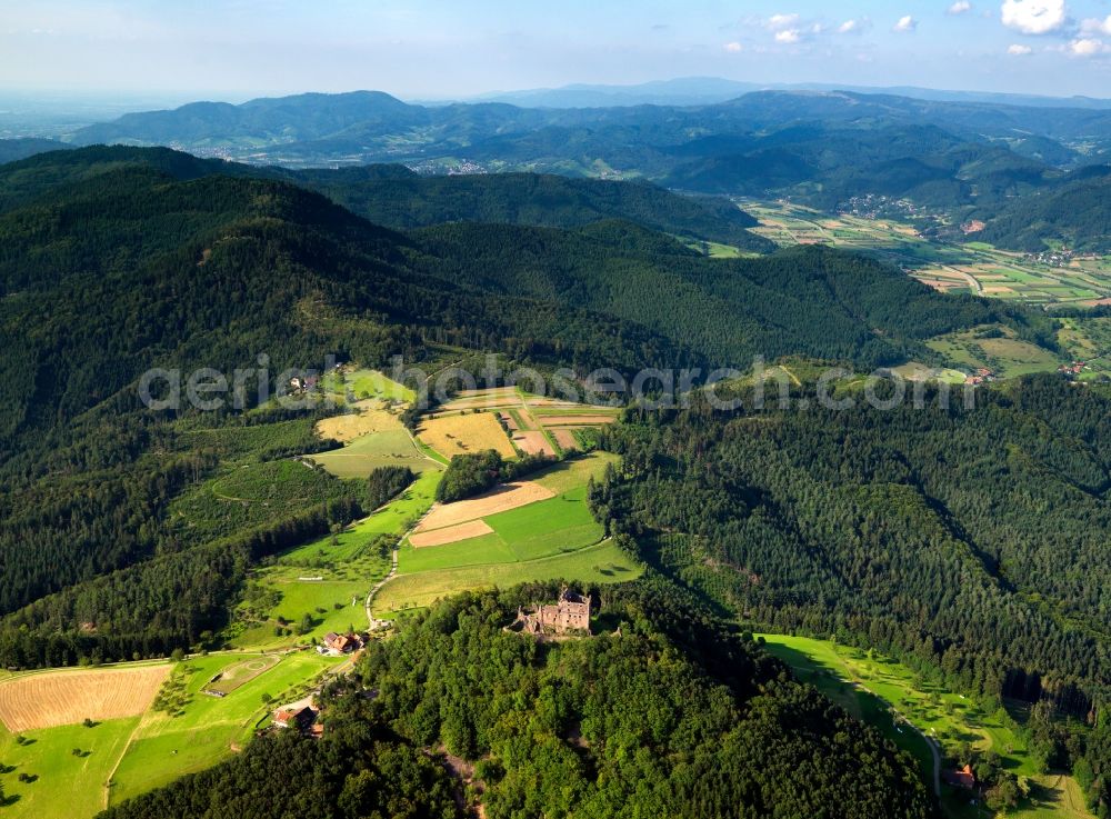 Seelbach from above - The ruins of fortress Hohengeroldseck in the Schönberg part of the borough of Seelbach in the state of Baden-Württemberg. The ruin and its remains are located in the Black Forest, on a hill between two valleys. The castle was originally built in 1260 and is currently refurbished and renovated. It is considered an important cultural heritage site of the region