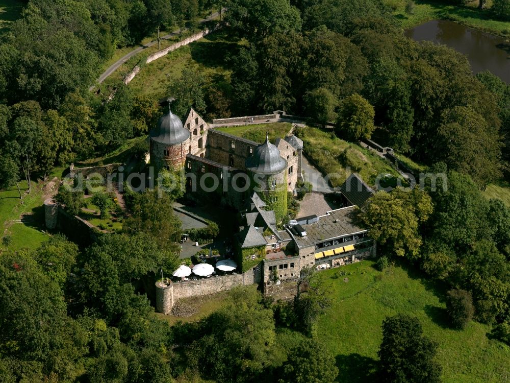 Aerial photograph Hofgeismar - The fortress Sababurg in the Rheinhards Forest in the Beberbeck part of Hofgeismar in the state of Hesse. The castle, also called Zapfenburg or Sleeping Beauty Castle, is the ruin of a former high fortress that was built in 1334. Starting in 1490 it was reconverted to a hunting lodge. The site contains a hotel that was built in 1959. Remains of the original fortress are the wall, the ditches and the two corner towers