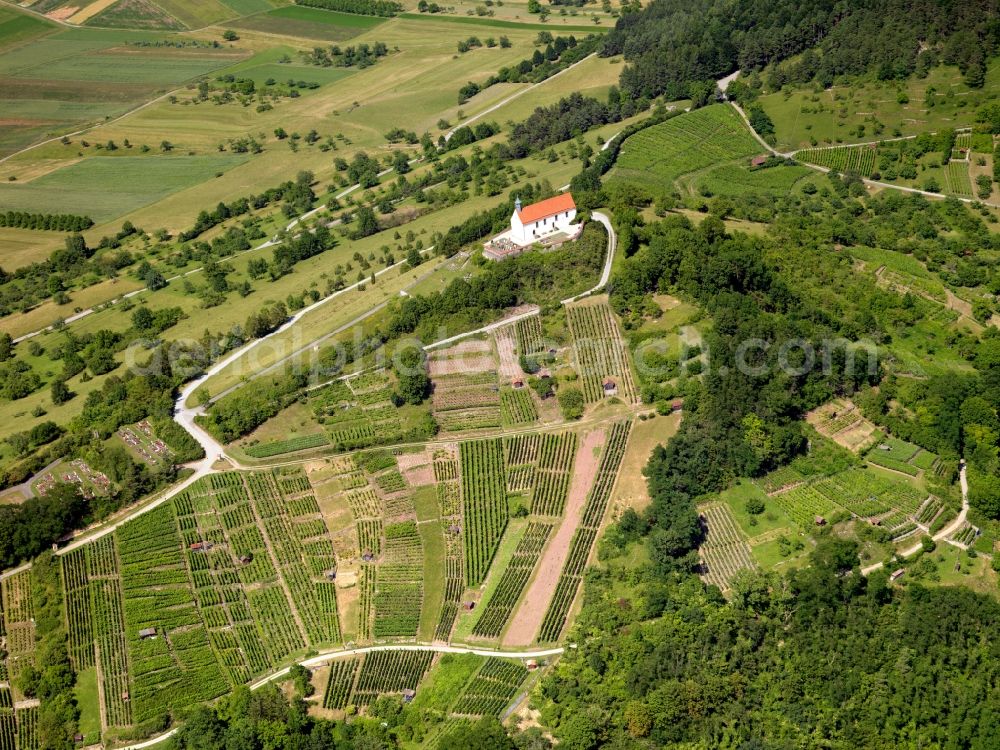 Aerial image Tübingen - The Wurmlinger chapel on the hill near by Chapel Tübingen is a very popular tourist and pilgrimage destination. The Romanesque previous building was 1050 in the tenure of Pope Leo IX. as a grave chapel of the founder, Count Anselm of Calw built there. The Romanesque crypt dates from around 1150. The Gothic successor building burned down in 1644th The Baroque chapel still standing today was inaugurated 1685th