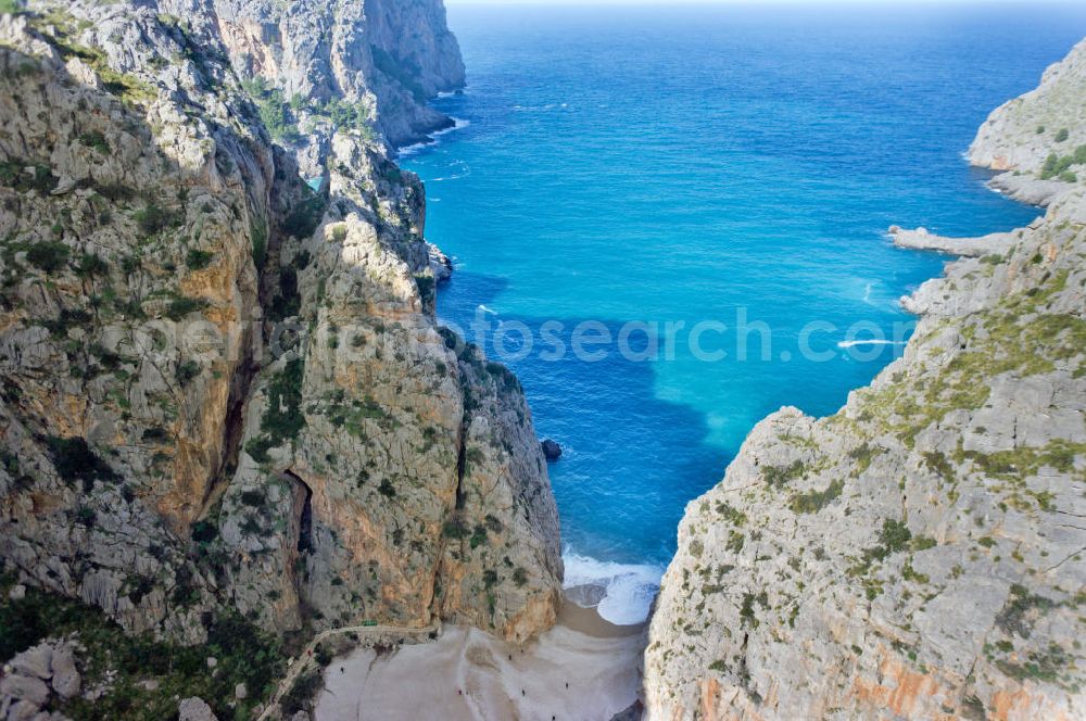 Aerial image ESCORCA OT SA CALOBRA - Canyon Torrent de Parlos on the rocky Mediterranean coast of the Spanish Balearic island of Mallorca