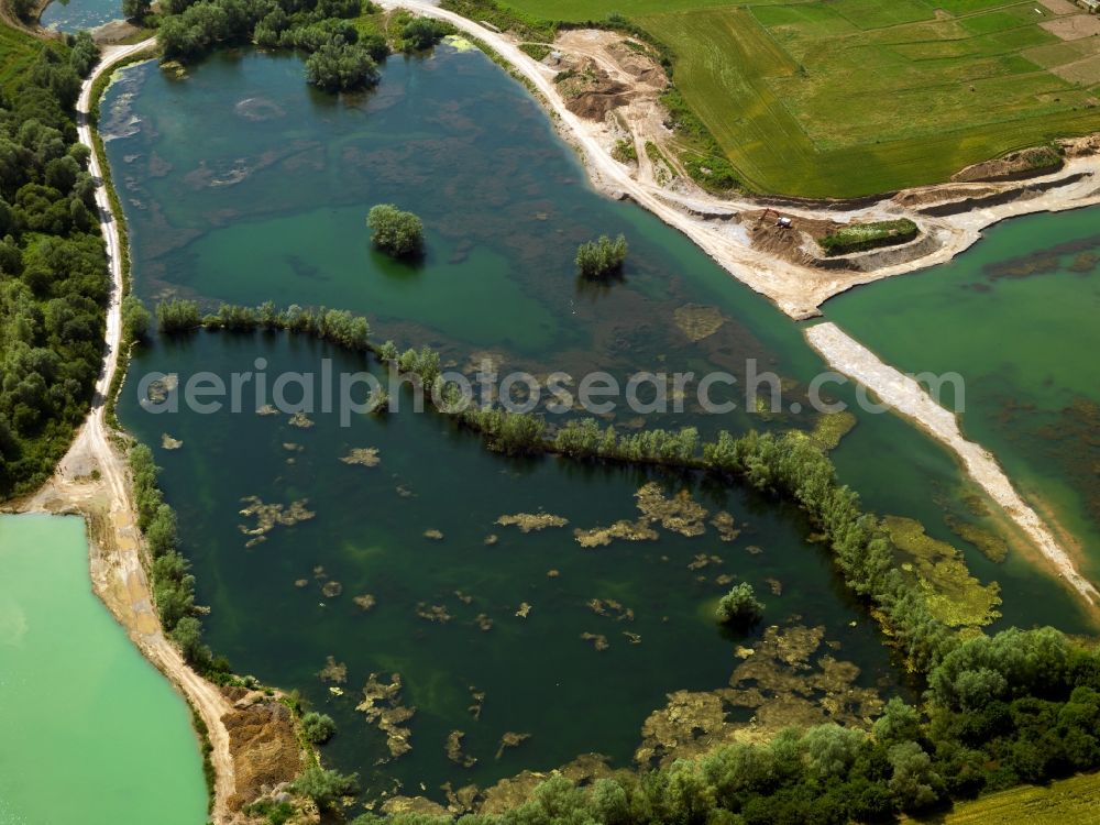 Brühl from above - The lakes near Brühl in the state of North Rhine-Westphalia. The city of Brühl is enclosed by lakes of different sizes. They came into existence primarly through the flooding of former mining pits and opencast pits. They are part of the Villeseen region and of the nature preserve Rhine Land. Today they are beloved leisure and tourist sites and used for swimming