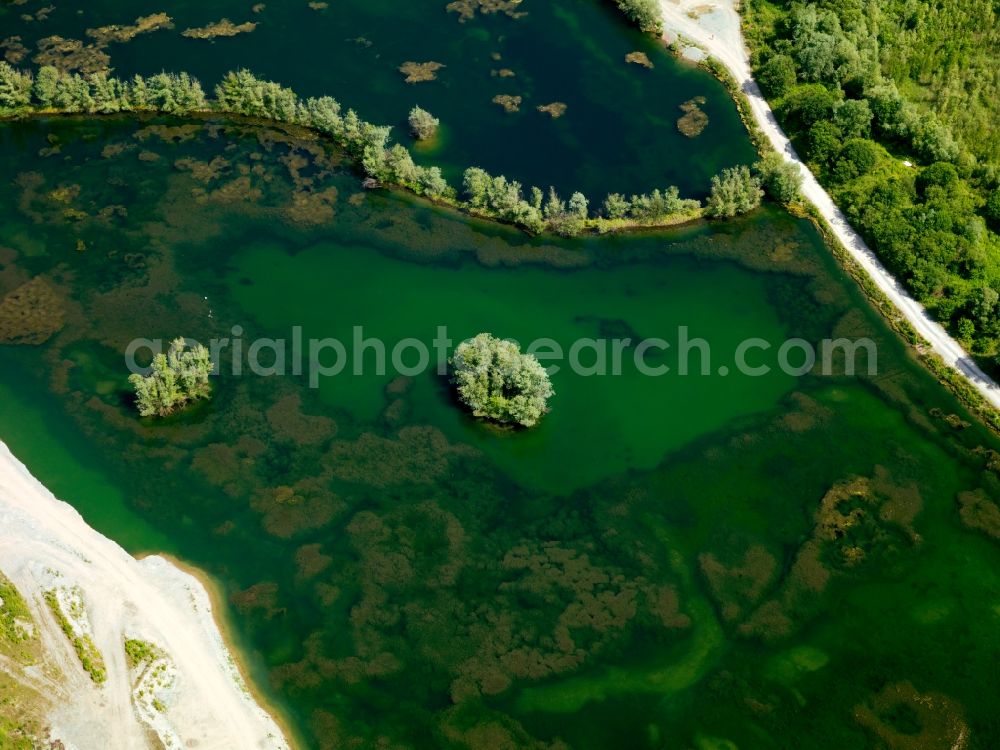 Aerial photograph Brühl - The lakes near Brühl in the state of North Rhine-Westphalia. The city of Brühl is enclosed by lakes of different sizes. They came into existence primarly through the flooding of former mining pits and opencast pits. They are part of the Villeseen region and of the nature preserve Rhine Land. Today they are beloved leisure and tourist sites and used for swimming