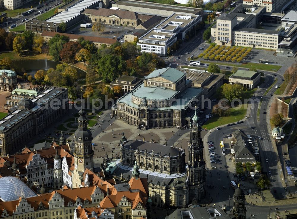 Dresden from above - The Semper Opera in Dresden, the opera house of the Saxon State Opera Dresden, as the Court and the Saxon State Opera has a long historical tradition. Orchestra of the Staatsoper, the traditional Dresden Staatskapelle. The Semper Opera House is located at the Theater Square in the historical center of Dresden. It is named after its architect Gottfried Semper. Next in the picture, the Royal Chapel and the Royal Palace