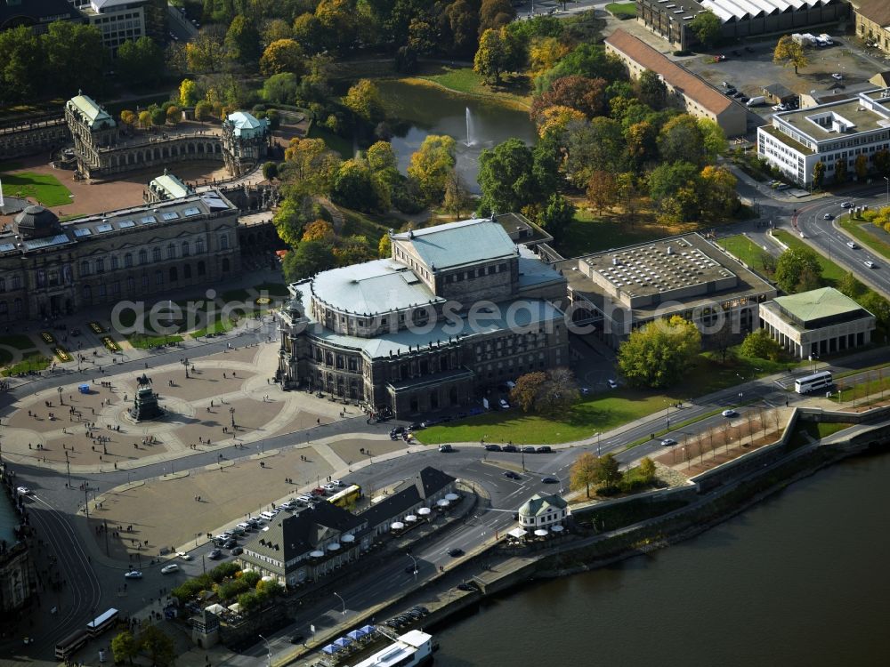 Dresden from above - The Semper Opera in Dresden, the opera house of the Saxon State Opera Dresden, as the Court and the Saxon State Opera has a long historical tradition. Orchestra of the Staatsoper, the traditional Dresden Staatskapelle. The Semper Opera House is located at the Theater Square in the historical center of Dresden. It is named after its architect Gottfried Semper. Next in the picture, the Royal Chapel and the Royal Palace