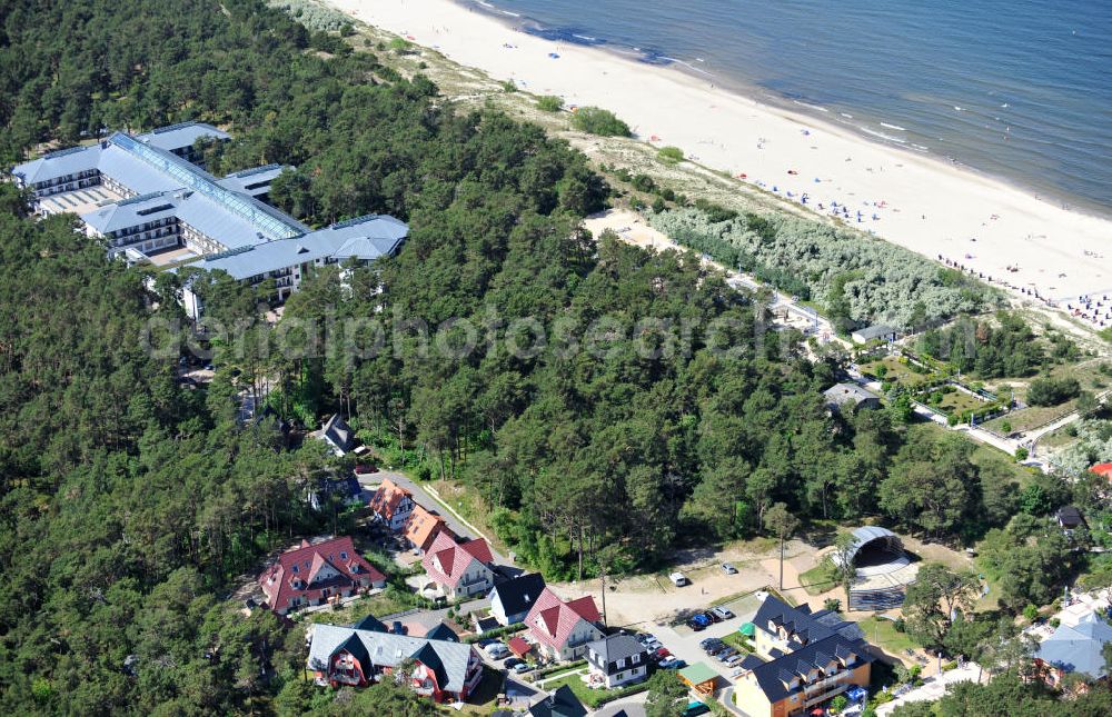 Trassenheide from above - View at the sea resort Trassenheide with the stage Kurmuschel, living houses, and holiday apartments. In the background is the MdiClin Dünenwald hospital which is part of the spa town