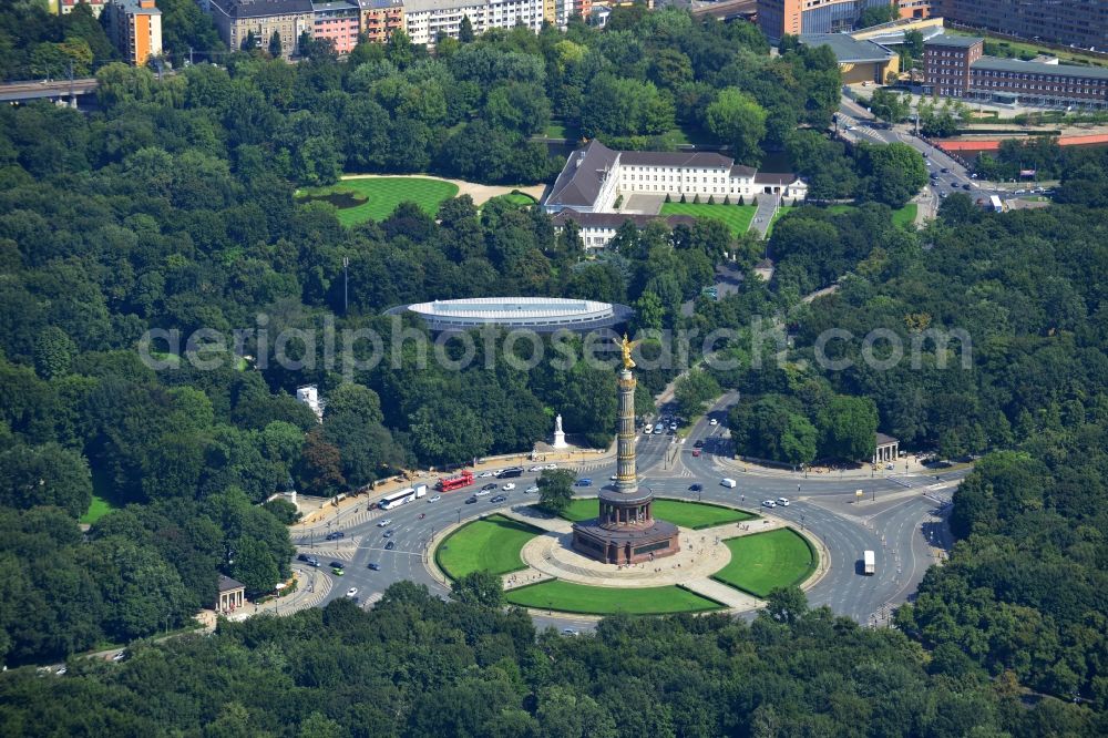 Berlin from above - The Siegessaeule at Grosser Stern in the middle of the Tiergarten in Berlin, was built from 1864 to 1873 as a national monument to the unification wars, designed by Heinrich Strack. Also on display is the Bundespraesidialamt and the street of the 17th June