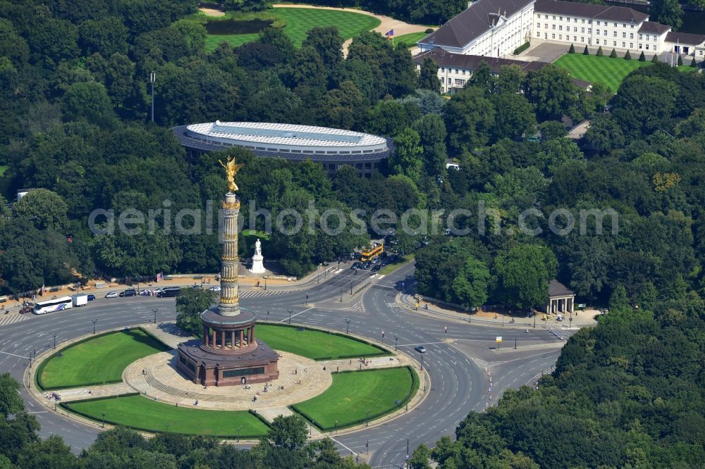 Berlin from the bird's eye view: The Siegessaeule at Grosser Stern in the middle of the Tiergarten in Berlin, was built from 1864 to 1873 as a national monument to the unification wars, designed by Heinrich Strack. Also on display is the Bundespraesidialamt and the street of the 17th June