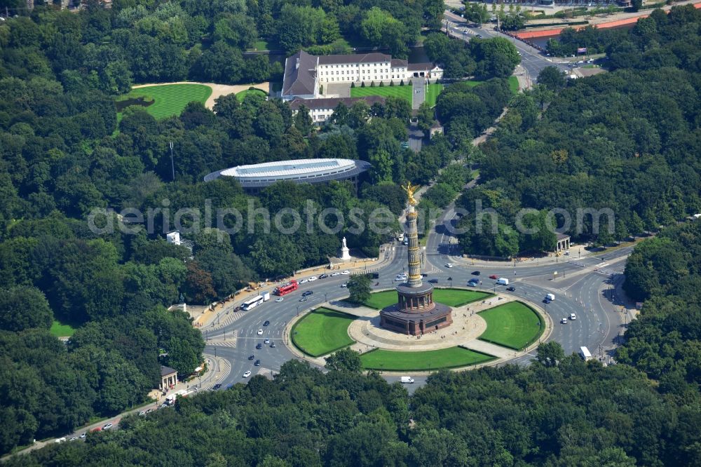 Berlin from above - The Siegessaeule at Grosser Stern in the middle of the Tiergarten in Berlin, was built from 1864 to 1873 as a national monument to the unification wars, designed by Heinrich Strack. Also on display is the Bundespraesidialamt and the street of the 17th June