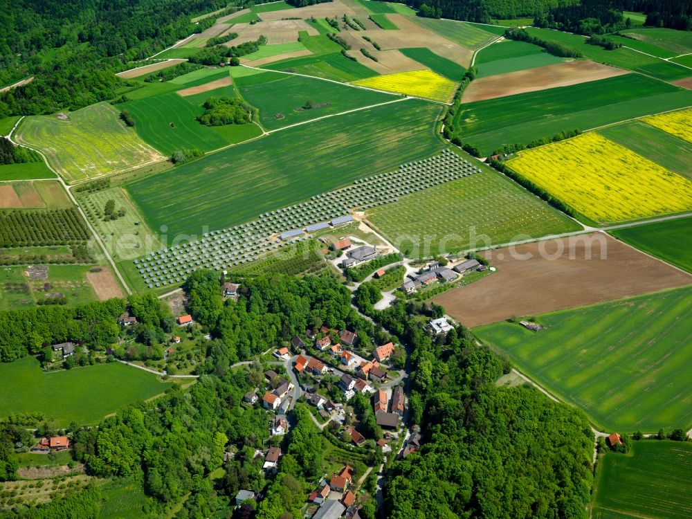 Forchheim from above - The solar energy plant in Forchheim in the Oberfranken region in the state of Bavaria. The photovoltaic plants are within and outside the city limits and are essential parts of the landscape