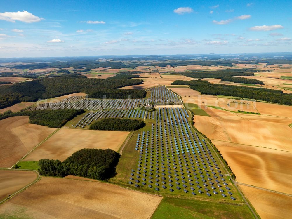 Arnstein from the bird's eye view: The solar energy plant in Arnstein in the Unterfranken region in the district of Main - Spessart in the state of Bavaria. The large photovoltaic facility is a joint project of the companies Solon SE, the project and distribution company S.A.G. Solarstrom AG and the energy company E.ON Bayern AG