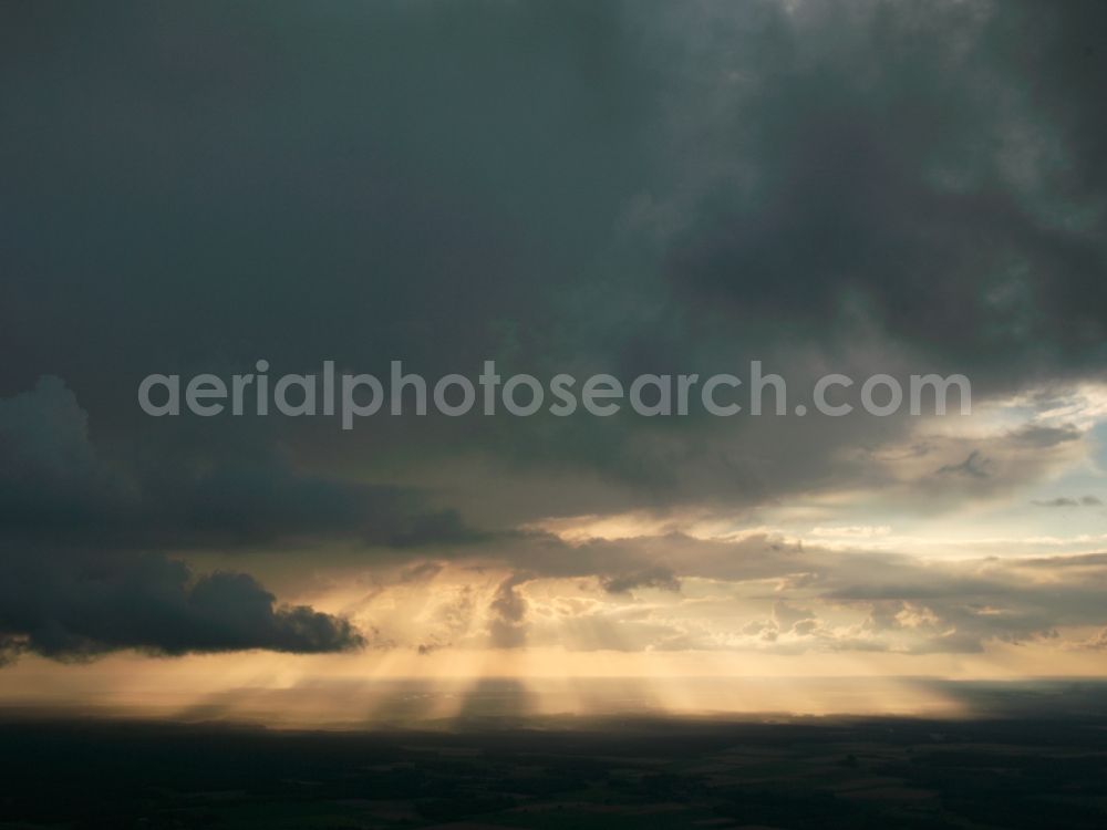 Lüneburg from the bird's eye view: View of the sunlight pierced the cloud cover over the Lüneburg Heath from Lüneburg in Lower Saxony