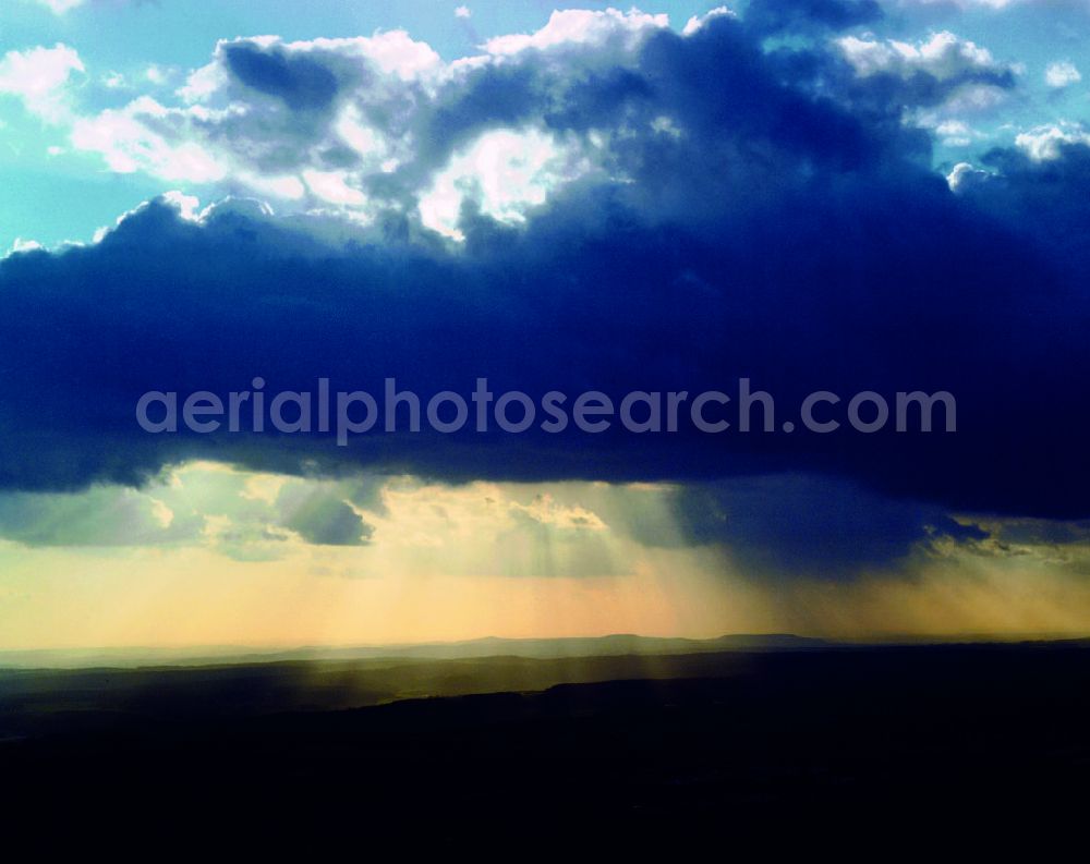 Aerial image Erfurt - View of the sunlight pierced clouds above the Steiger forest near Erfurt in Thuringia