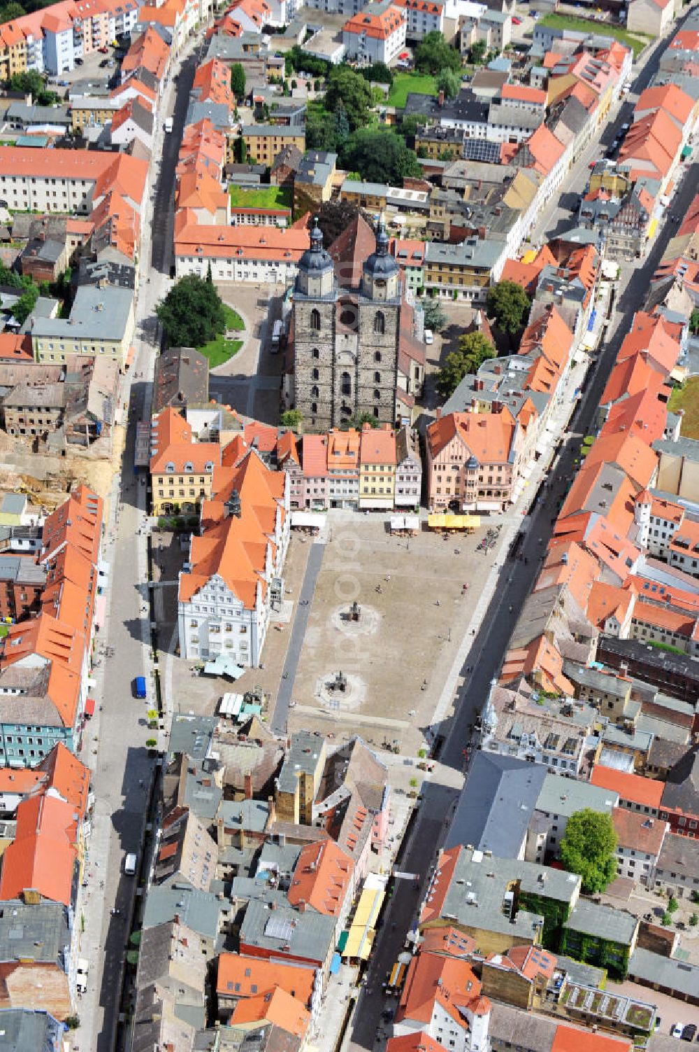 Wittenberg from the bird's eye view: View of the city and parish church of St. Mary's on the market square of Wittenberg. As a church of the priests Martin Luther and Johannes Bugenhagen during Reformation, it has the status as a World Heritage Site by UNESCO since 1996. At the market place, the monuments of Martin Luther and Philipp Melanchton are located