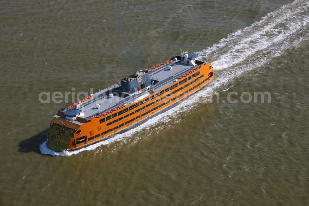 Aerial photograph New York - The Staten Island Ferry is a ferry in the port of New York City and is operated by the New York City Department of Transportation. A ferry needs about 22 minutes for one drive