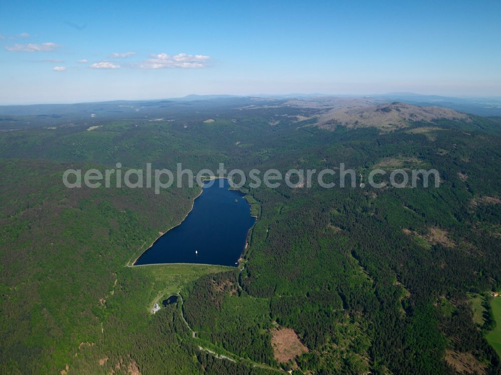 Frauenau from above - The barrage Frauenau in the state of Bavaria. The barrier lake is located in the Bavarian Forest near Frauenau and was completed in 1983 to guarantee the provision of drinking water for the region. The landscape with its hills is visible here as well. The dam is located on the western end of the lake and is over 70m high