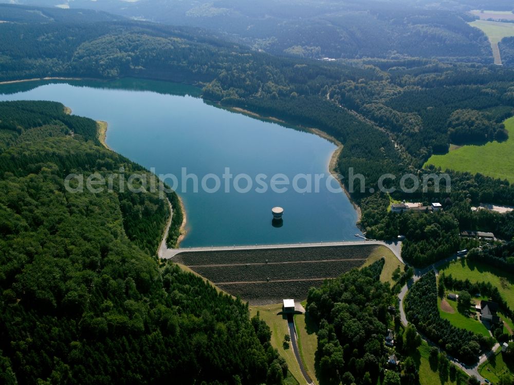 Lichtenberg/Erzgebirge from the bird's eye view: The dam in the district of Lichtenberg in the Erz Mountains in the state of Saxony. The dam is used for drinking water supply, for flooding protection and to produce power. The tower behind the dam is used to take water from the barrier lake