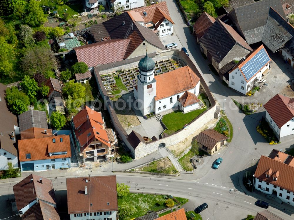 Aerial image Öllingen - The church of St. Ulrich, on the outskirts of the village, is surrounded by a church wall. In the small area located next to the building itself, a small cemetery