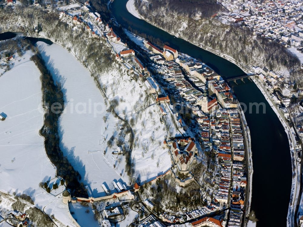 Aerial image Burghausen - The snow covered city of Burghausen in the county district of Altötting in the state of Bavaria. The former seat of dukes and counts is the largest city in the region of Oberbayern. It is located on the river Salzach. Burghausen Castle rests along a ridgeline above the city centre. It is the longest Castle in Europe