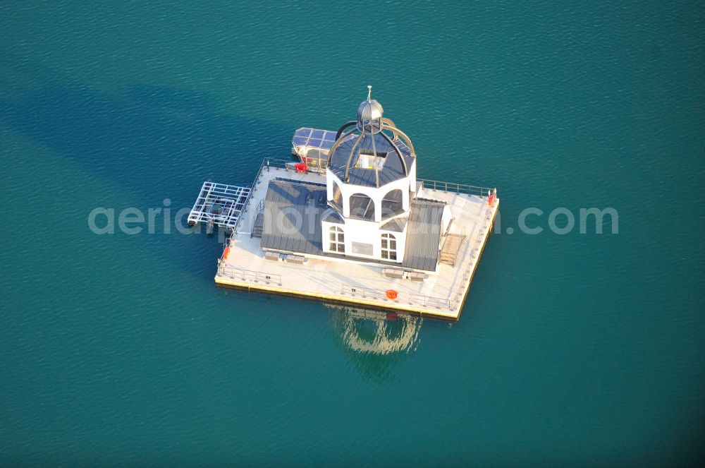 Aerial photograph Störmthal - Die schwimmende Gebäude Vineta auf dem Störmthaler See ist ein Projekt der Künstlerinitiative Kunst statt Kohle . Das Gebäude ähnelt architektonisch einem Sakralbau und soll an die Kirche des dem Braunkohle-Tagebau gewichenen Ortes Magdeborn erinnern. Vineta on sea Störmthaler See is a project of artists' initiative Kunst statt Kohle. Standing on a swimming foundation, the buildings structure is based on sacred architecture and is supposed to remember the church of former village Magdeborn, which was destroyed by surface mining.