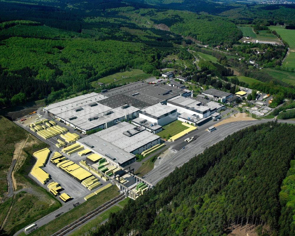 Aerial photograph Warstein - The Warsteiner Brewery near Warstein in the state of North Rhine-Westphalia. The brewery is located in the South of the city amidst hills and forest. The Warsteiner Brauerei Haus Cramer KG is one of the largest breweries in Germany and produces beer for the domestic and foreign market. The site has been in use since the early 19th century. Today the company offers a huge selection of different beers and is one of the economy drivers in the region