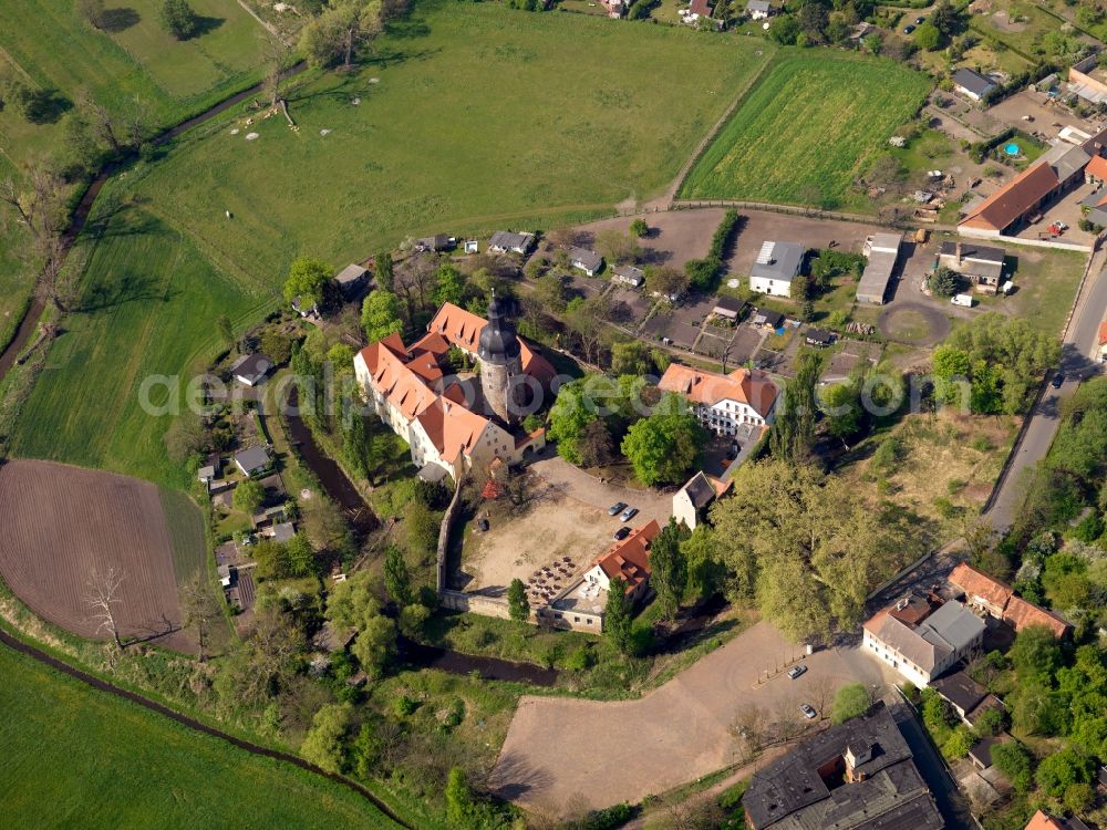 Gommern from the bird's eye view: The fortress Gommern in the district of Jerichower Land in the state of Saxony-Anhalt. The water castle is located on an artificial hill. It was originally built in the 10th century. Its large tower is its most prominent feature. Today it is home to a restaurant, brewery and hotel