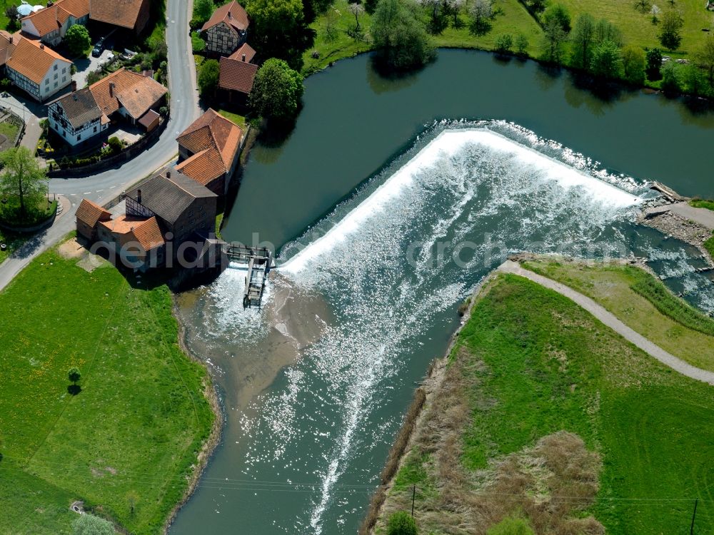 Gerstungen from the bird's eye view: The mill on the river Werra in the Sallmannshausen part of the borough of Gerstungen in the state of Thuringia. The river runs from South to the North and passes the village center across a small step. On the riverbank there is the old mill