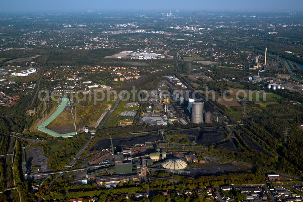 Aerial image Bottrop - The mine Prosper and the alpine center in Bottrop in the state of North Rhine-Westphalia. The brown coal pit is still in use today but the area visible here is also used differently. There is the Malakow Tower - a industrial memorial site - , as well as residential areas. It is also home to the alpine center, the longest indoor skiing slope in the world, a summer coasting slide, a ropes course and a paintball hall