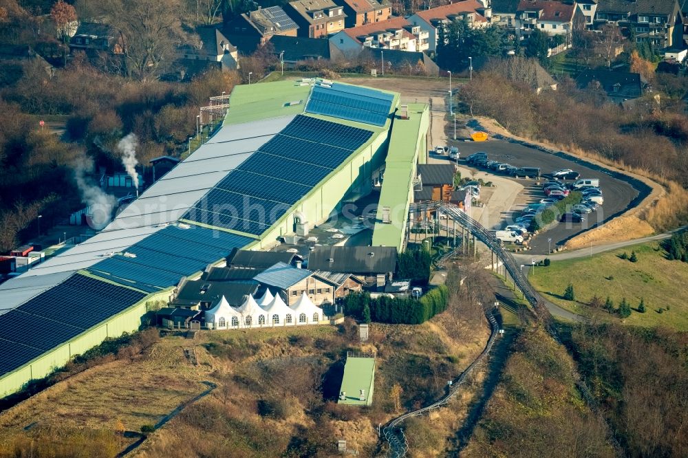 Aerial image Bottrop - The mine Prosper and the alpine center in Bottrop in the state of North Rhine-Westphalia. The brown coal pit is still in use today but the area visible here is also used differently. There is the Malakow Tower - a industrial memorial site - , as well as residential areas. It is also home to the alpine center, the longest indoor skiing slope in the world, a summer coasting slide, a ropes course and a paintball hall