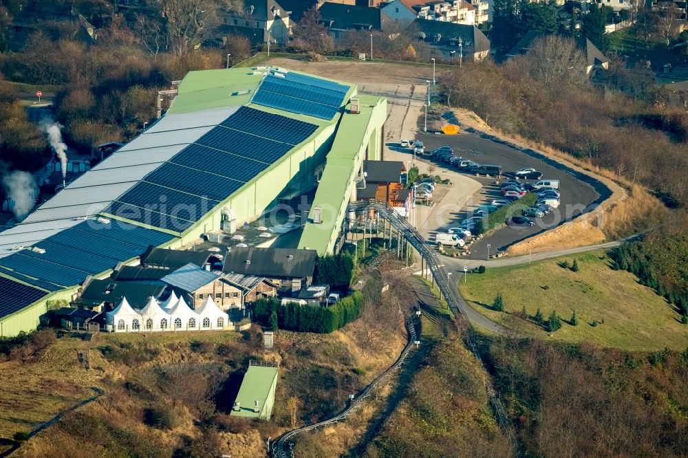 Aerial photograph Bottrop - The mine Prosper and the alpine center in Bottrop in the state of North Rhine-Westphalia. The brown coal pit is still in use today but the area visible here is also used differently. There is the Malakow Tower - a industrial memorial site - , as well as residential areas. It is also home to the alpine center, the longest indoor skiing slope in the world, a summer coasting slide, a ropes course and a paintball hall